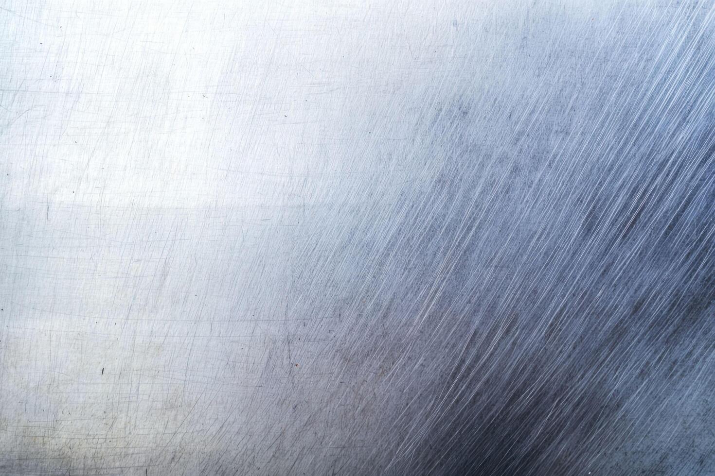 The brushed steel texture background features a sleek, linear pattern of fine, parallel lines with a metallic sheen photo