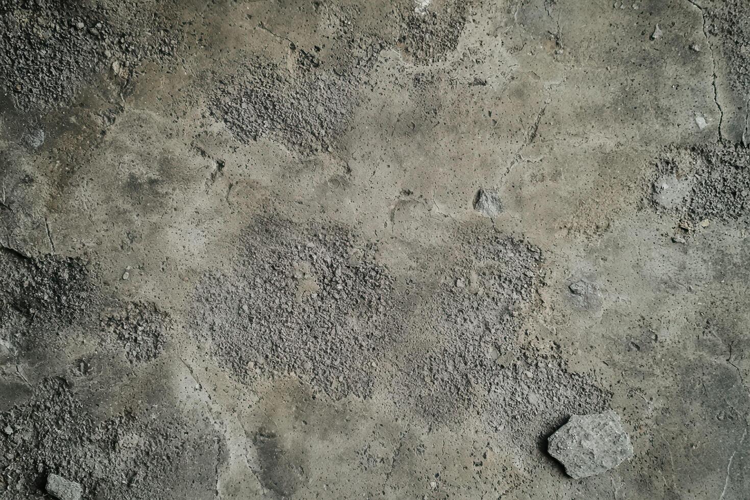 A rough, gray cement texture background with subtle variations photo