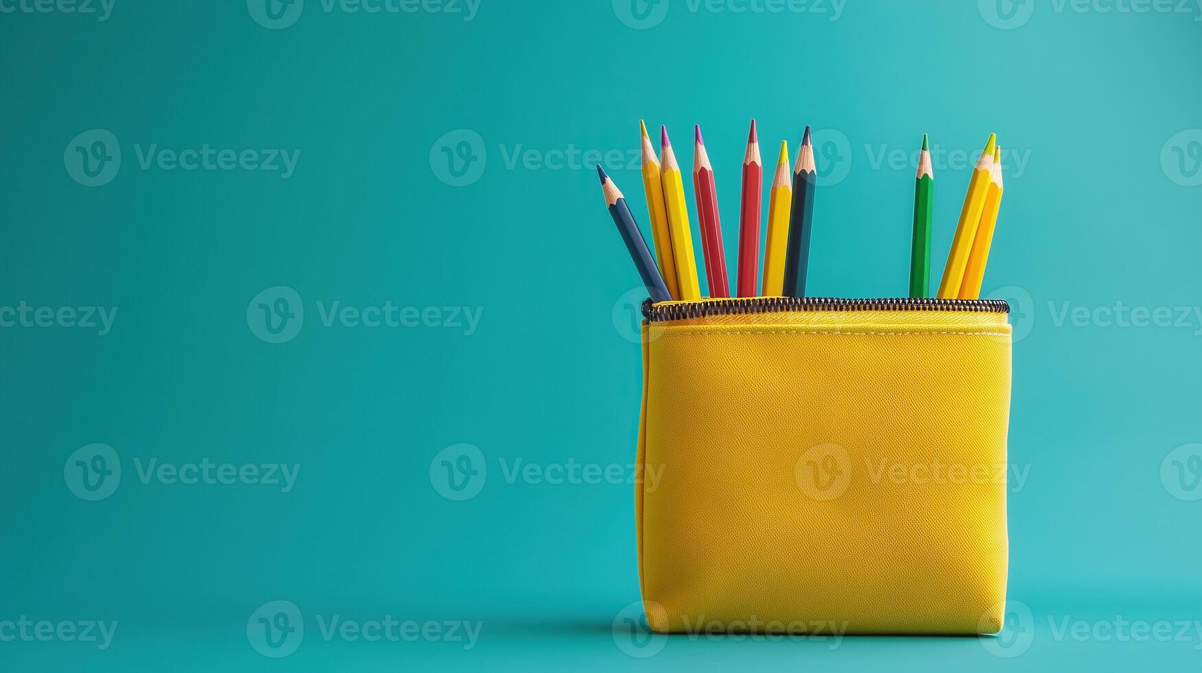 Yellow pencil case with colorful pencils photo