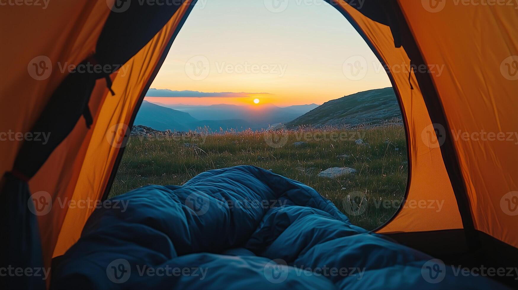 View of the serene landscape from inside a tent. photo