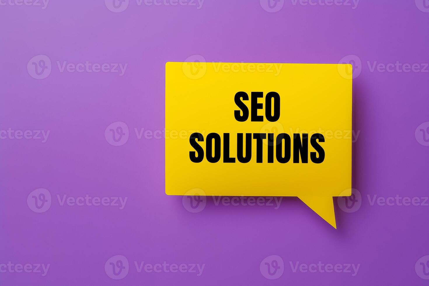 Seo solutions message written on yellow paper speech bubble on purple background. Conceptual seo solutions symbol. Copy space. photo