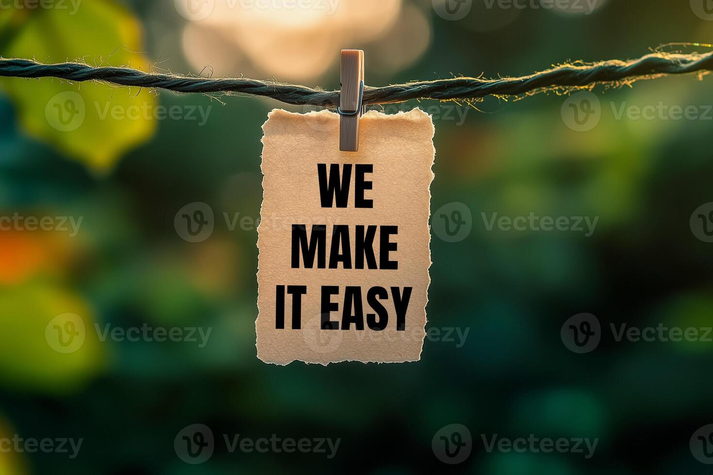 We make it easy message written on paper hung with clothespins. Conceptual we make it easy symbol. Copy space. photo