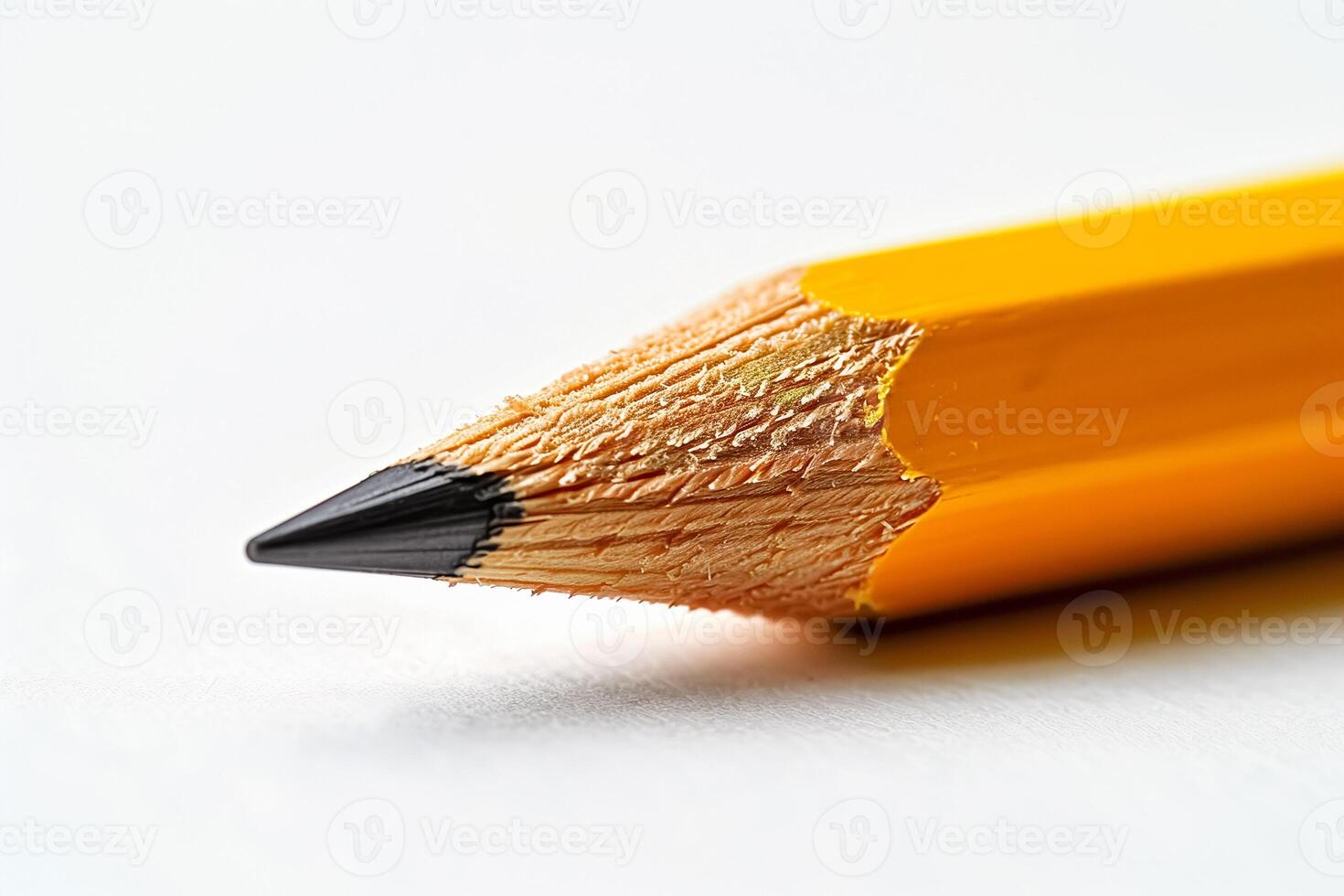 Sharpened yellow pencil on white background photo
