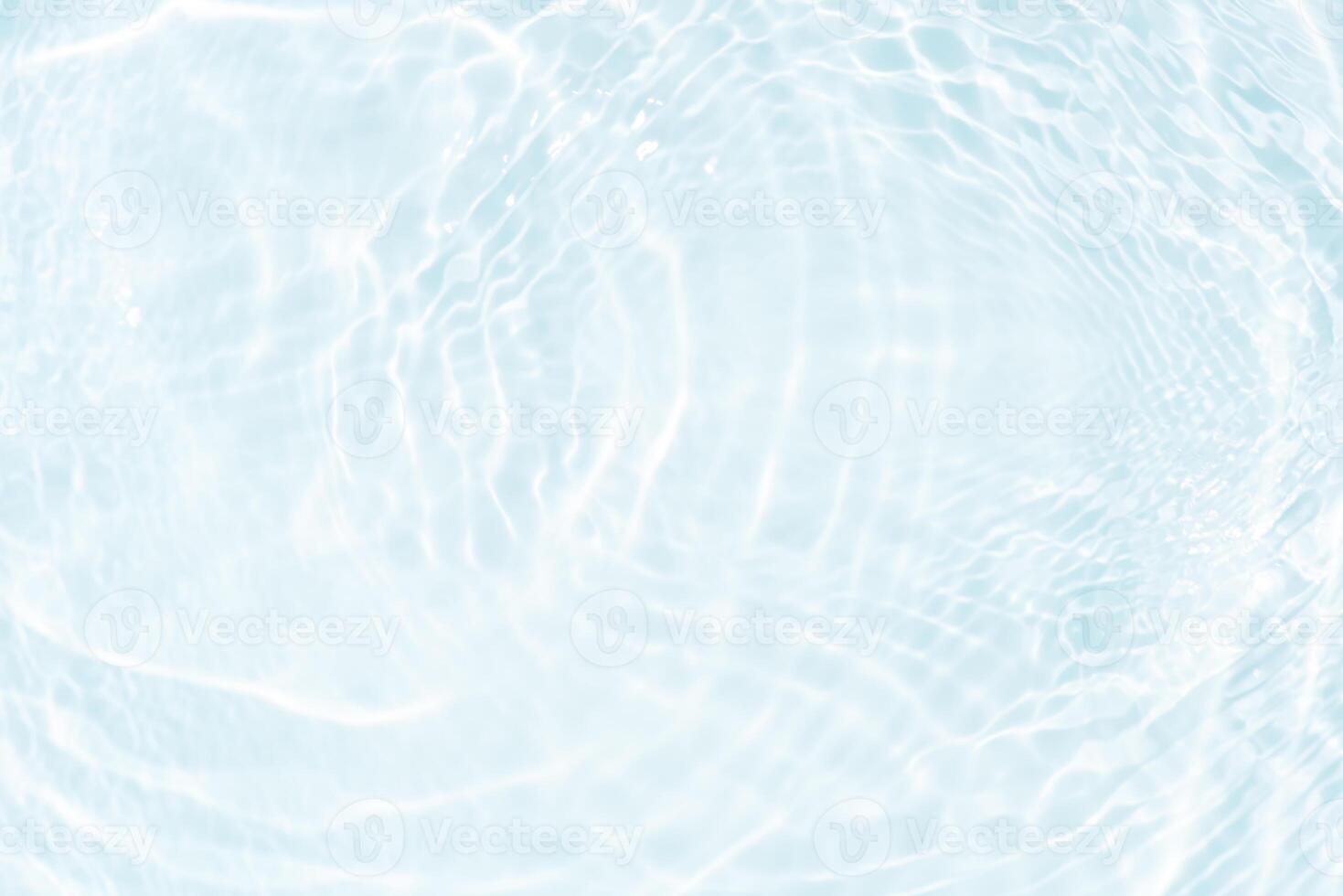 Bluewater waves on the surface ripples blurred. Defocus blurred transparent blue colored clear calm water surface texture with splash and bubbles. Water waves with shining pattern texture background. photo
