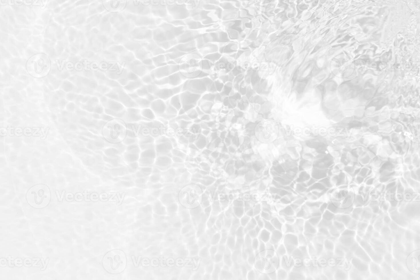 Bluewater waves on the surface ripples blurred. Defocus blurred transparent blue colored clear calm water surface texture with splash and bubbles. Water waves with shining pattern texture background. photo