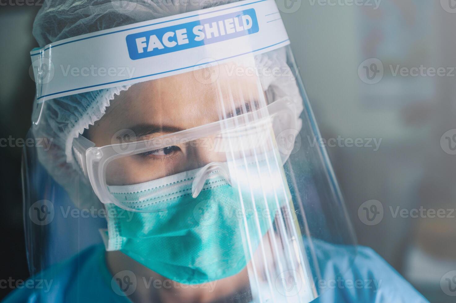 Nurse having tired from work while wearing PPE suit for protect coronavirus disease. PPE while protecting healthcare workers from exposure to the COVID-19 virus in healthcare settings. photo