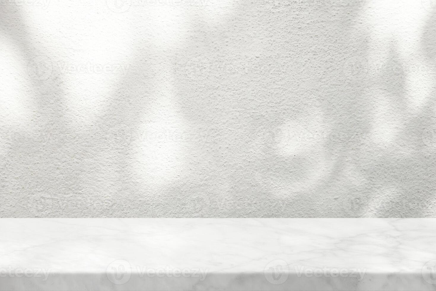 White Marble Table with Tree Shadow on Concrete Wall Texture Background photo