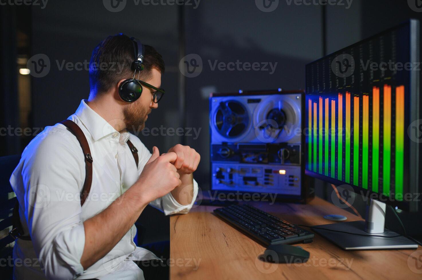 Secret agent listens on the reel tape recorder. Officer wiretapping in headphones. Spying of conversations. Intelligence gathering. Espionage concept photo