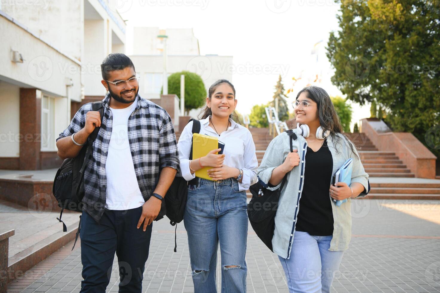 Cheerful Indian asian young group of college students or friends together photo