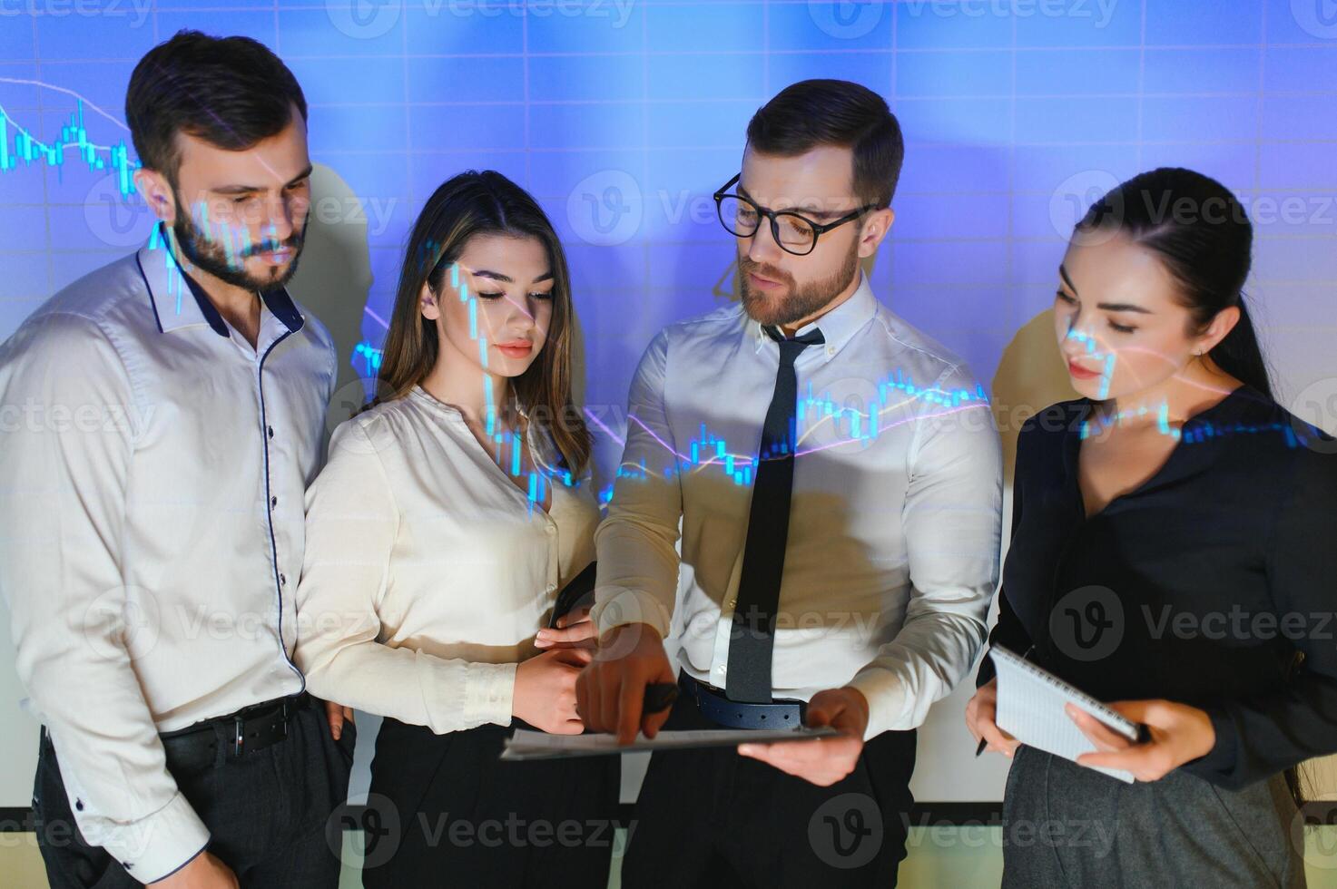 Trading teaching. Male leader talking to employees, showing the plan on the projector in office of stock exchange company. photo