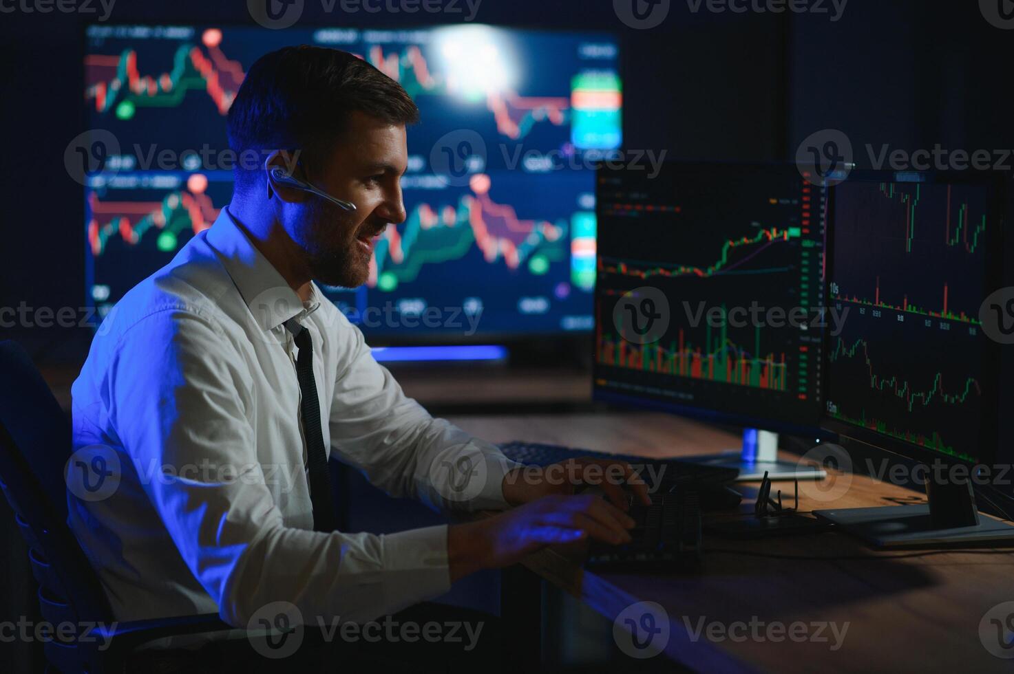 Financial Analysts and Day Traders Working on a Computers with Multi-Monitor photo