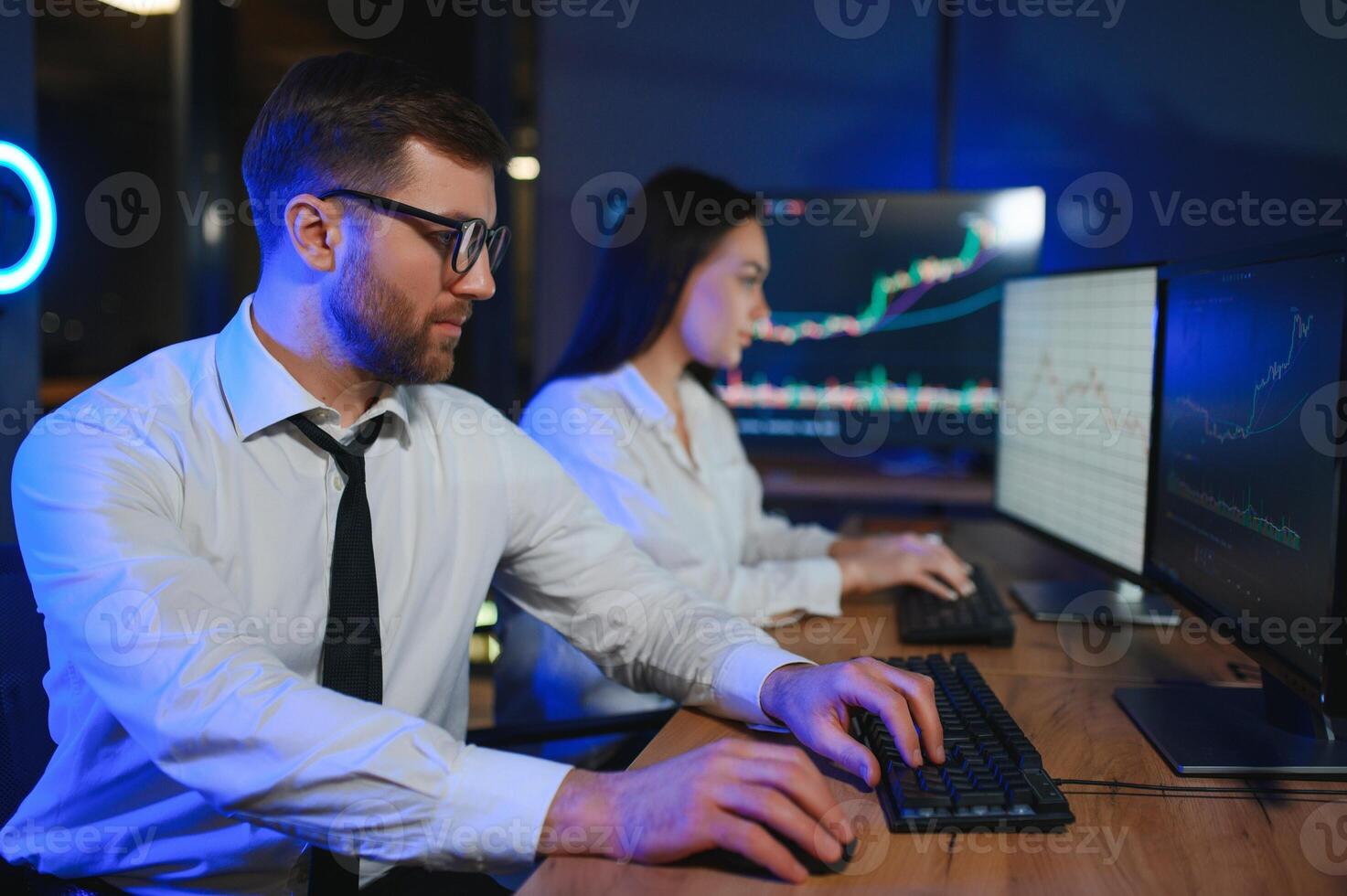Financial Analyst Talking to Investment Banker in Late Evening at Work photo