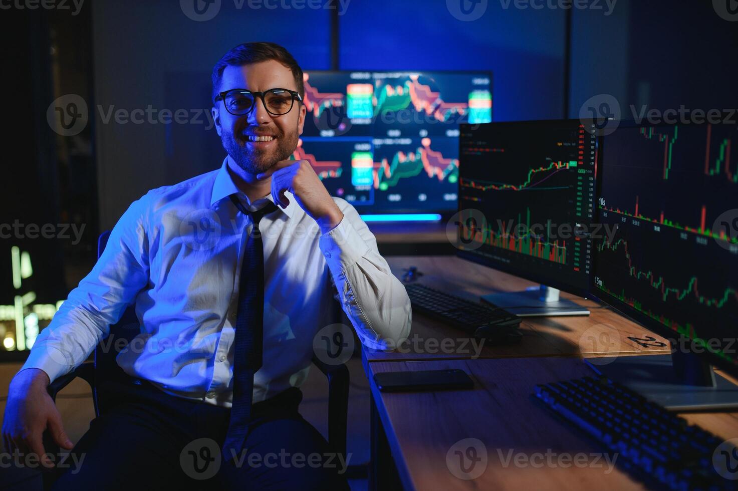 Financial Analysts and Day Traders Working on a Computers with Multi-Monitor photo