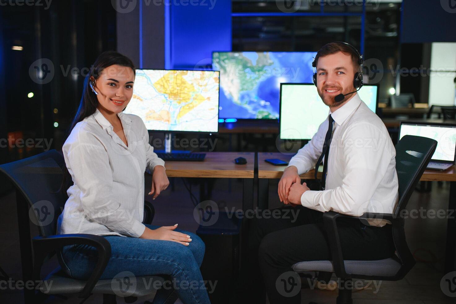 Diverse call center operators team use computers consulting clients in office photo