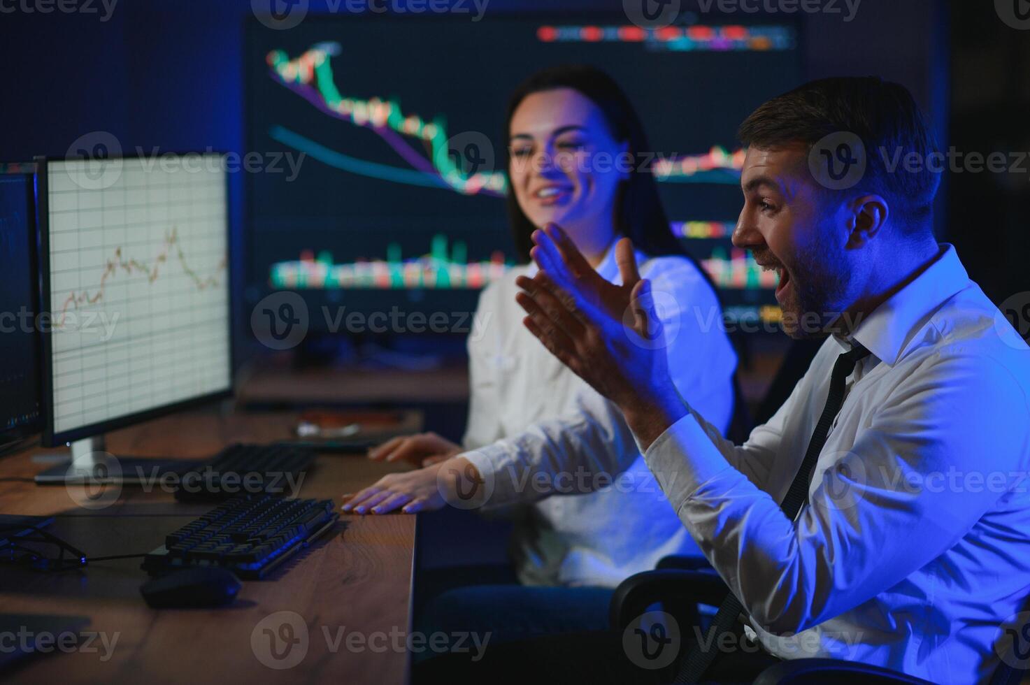 Team of traders working at monitor computer and browsing online in trading office photo