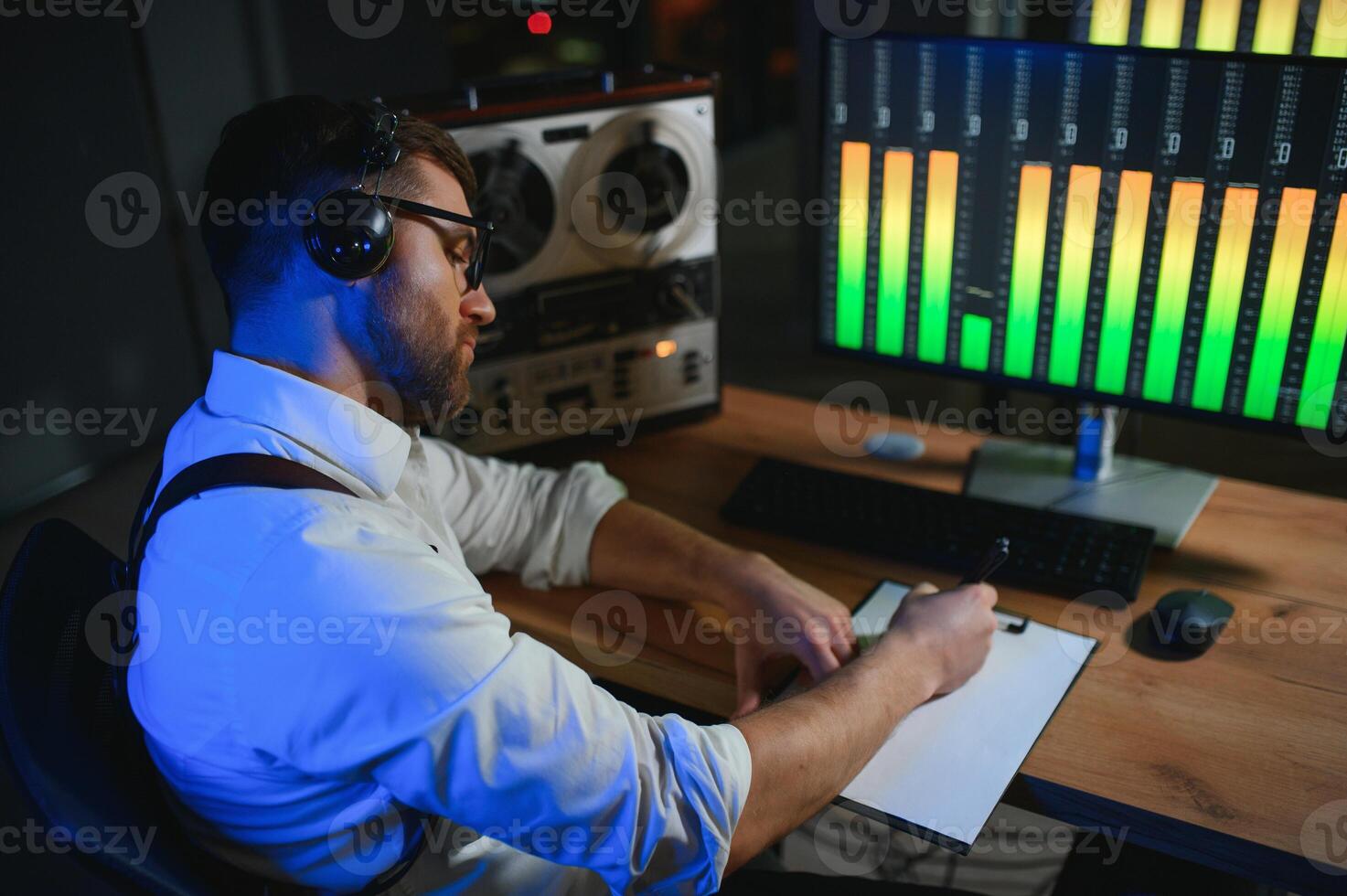 A police officer records a telephone conversation on a tape recorder. secret agent photo