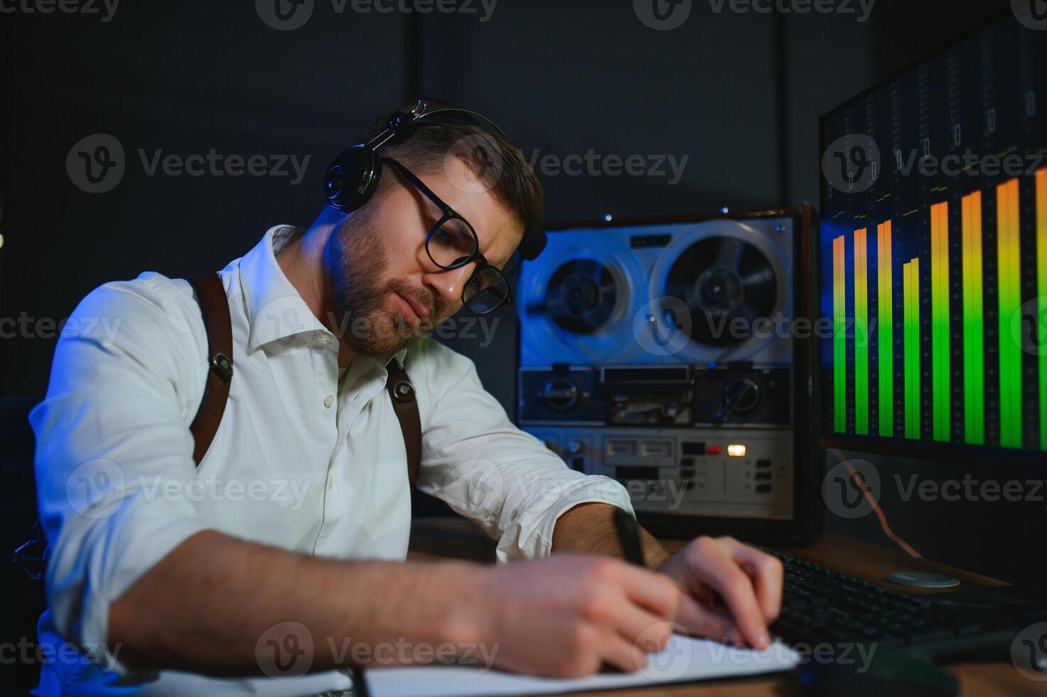 A police officer records a telephone conversation on a tape recorder. secret agent photo