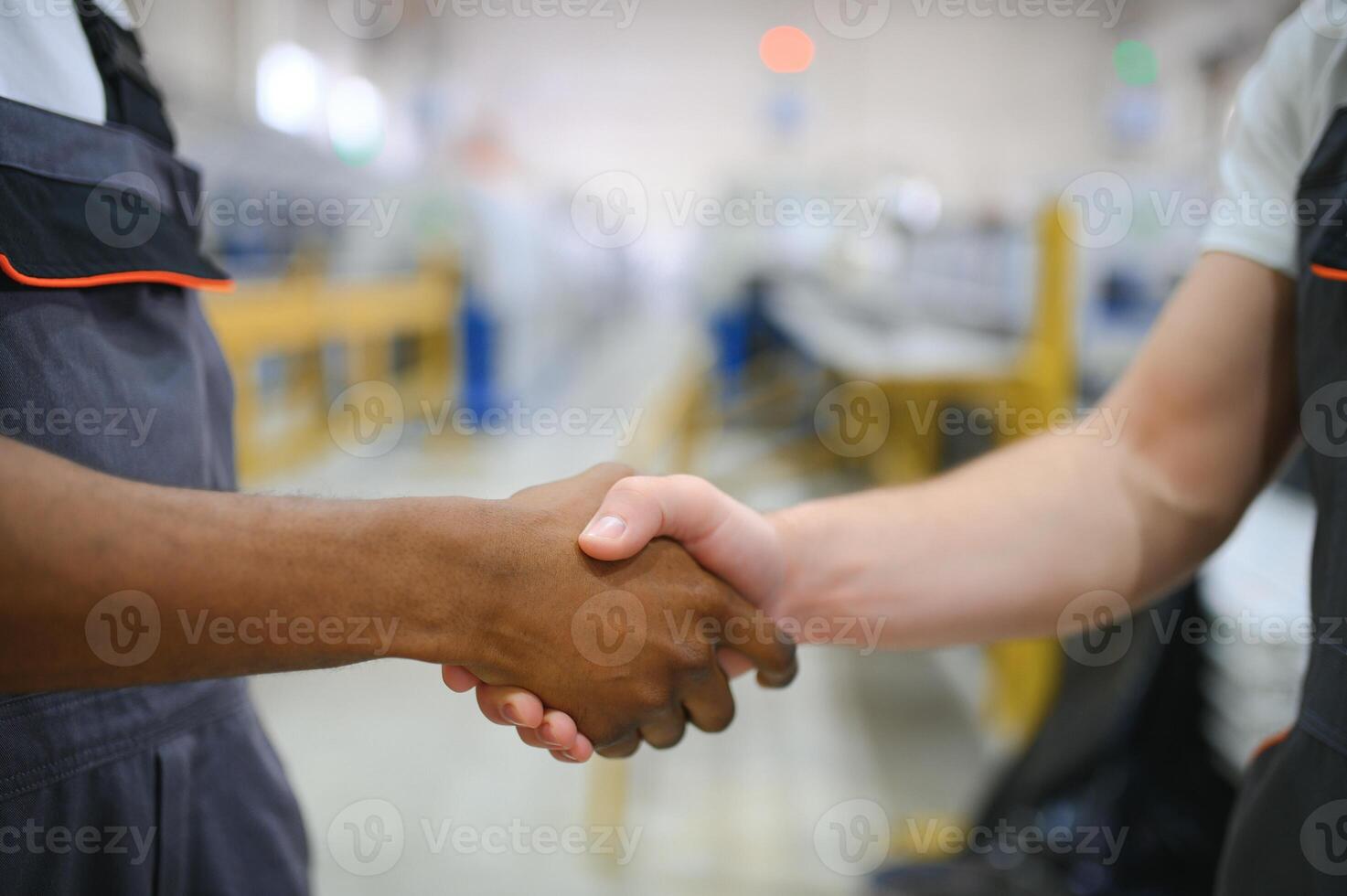 Two workers at the factory. Engineer and worker photo