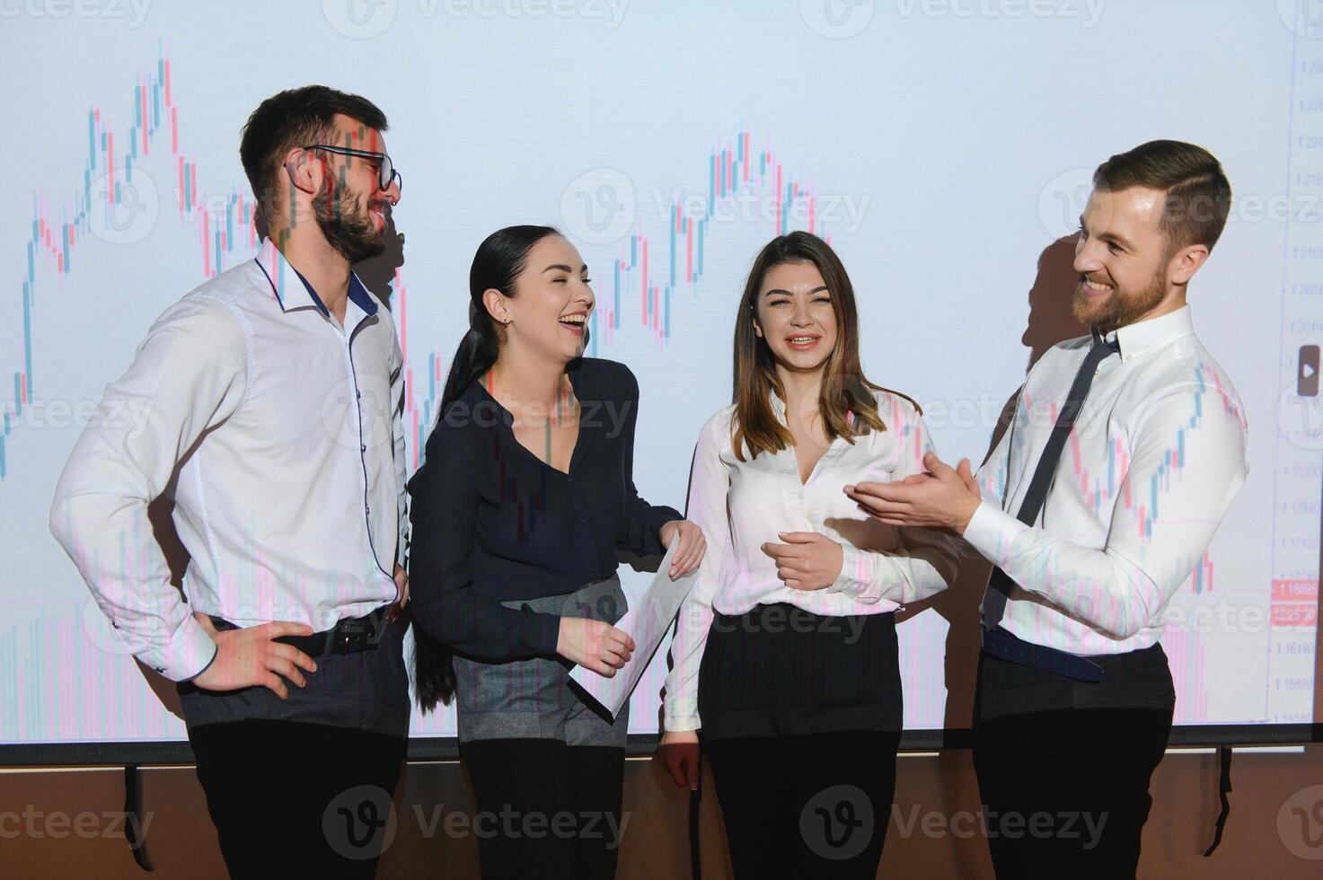 Group of business people working. Technical price graph and indicator, red and blue candlestick chart and stock trading computer screen background. Traders analyzing data photo