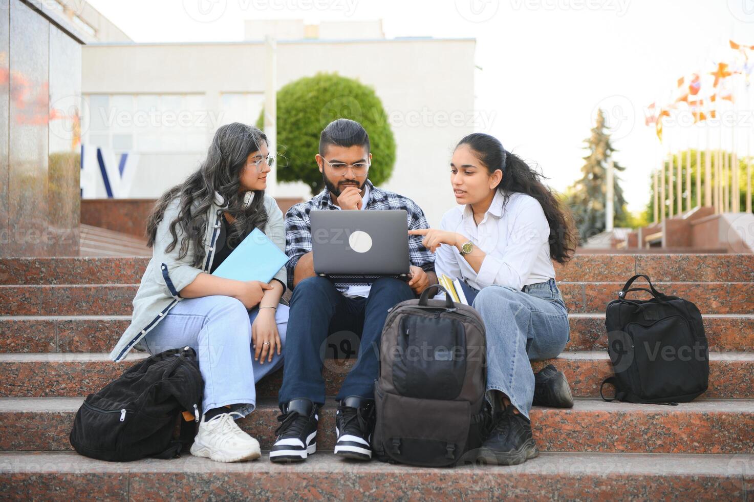 Group of smiling multiethnic near university campus photo