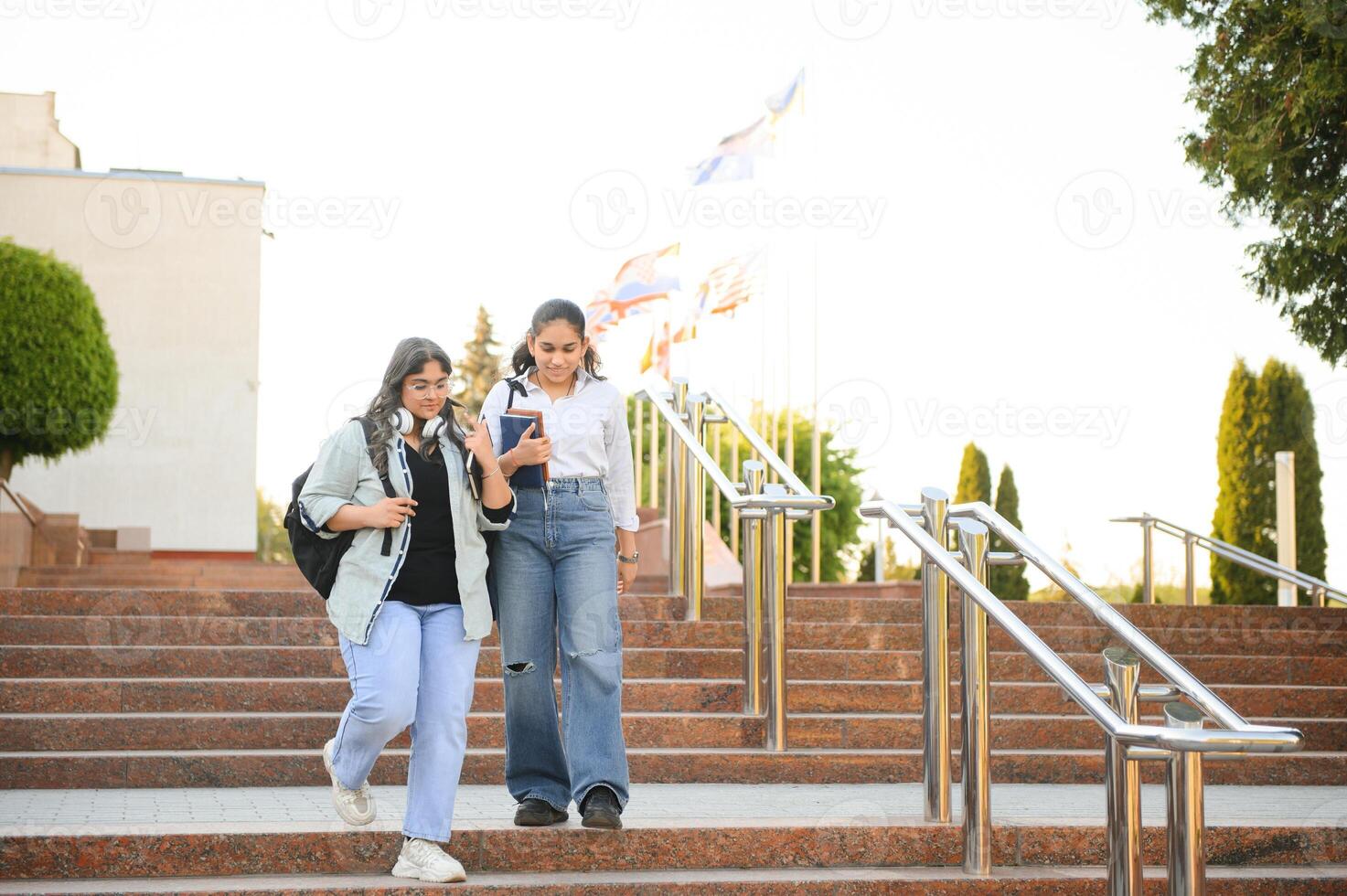 Group of smiling multiethnic near university campus photo