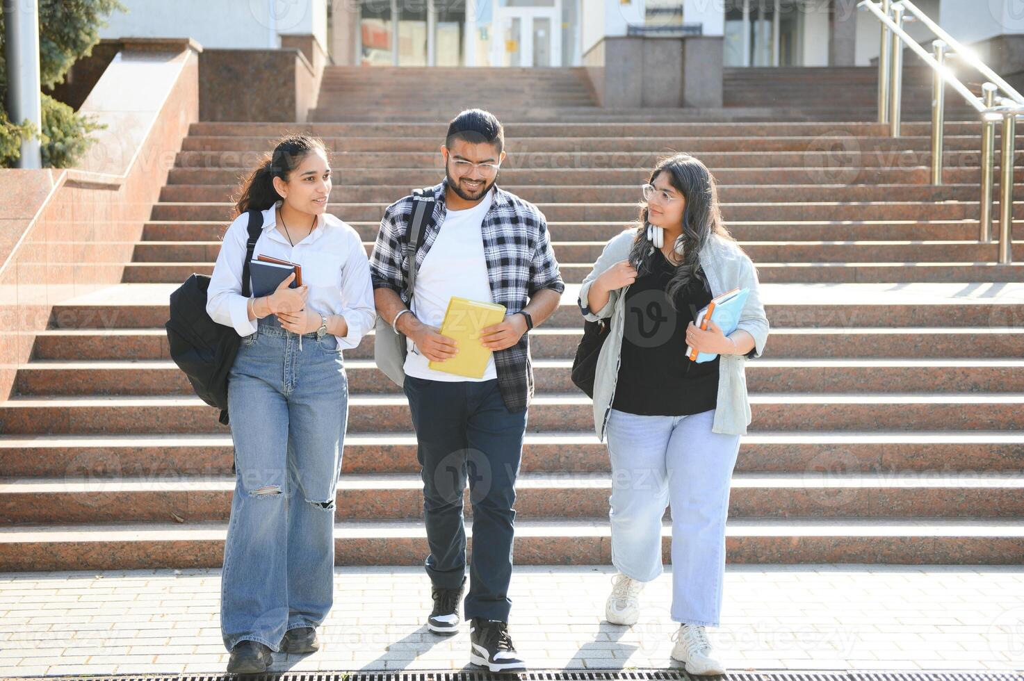 Cheerful Indian asian young group of college students or friends together photo