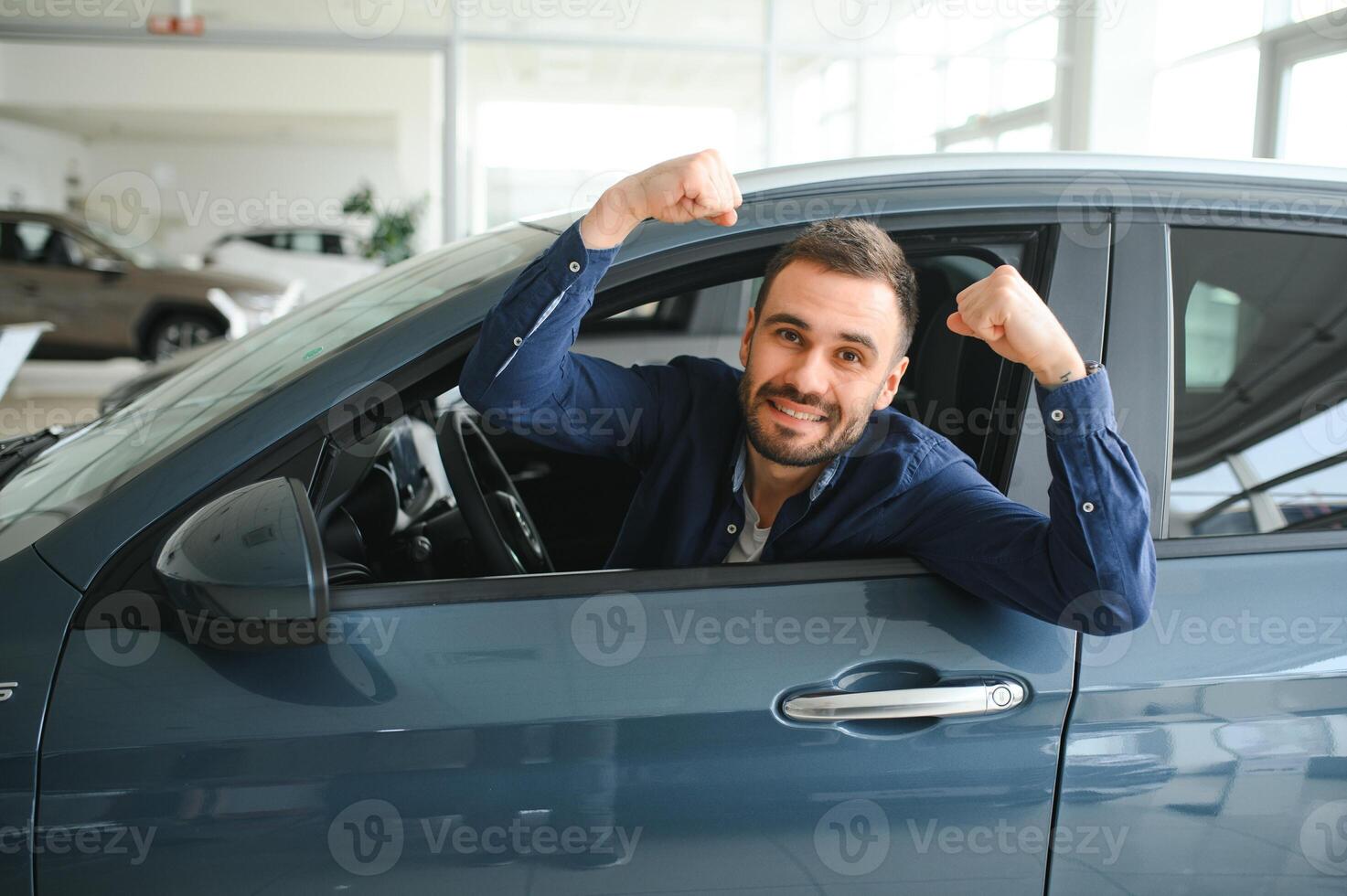 Man customer male buyer client chooses auto wants to buy new automobile photo