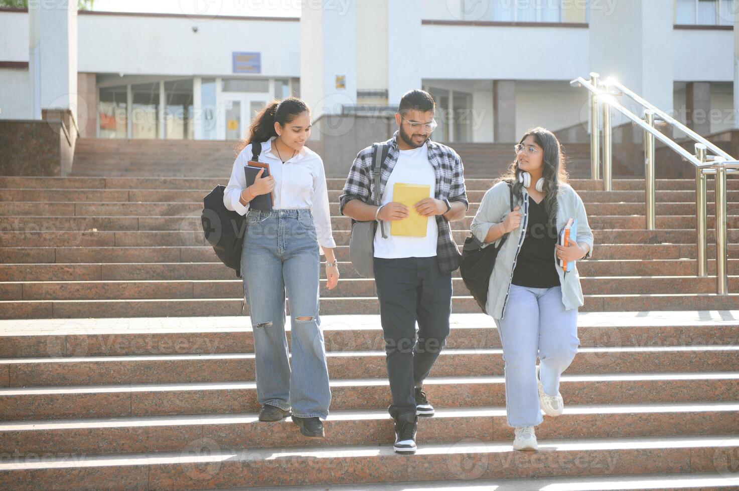 Cheerful Indian asian young group of college students or friends together photo