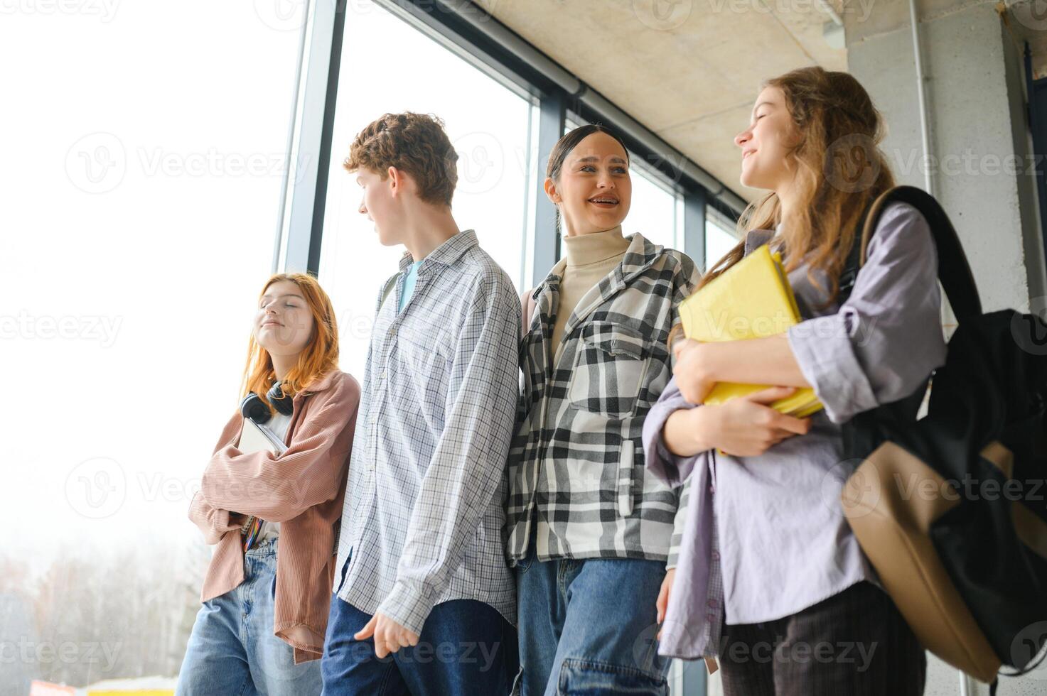 Happy high school students in the classroom photo