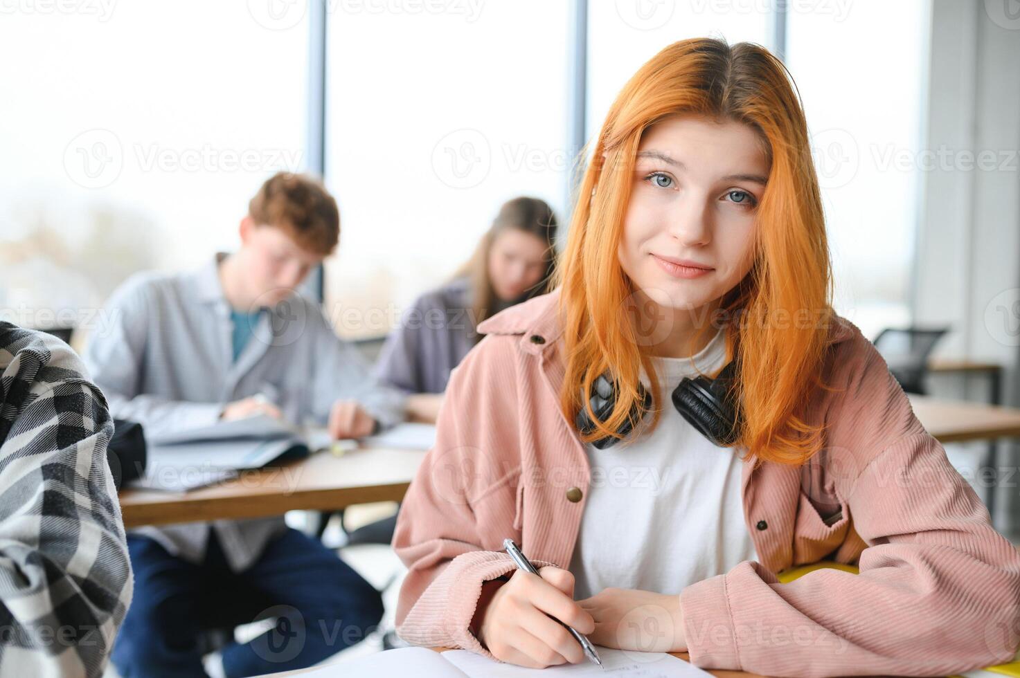 Students studying in library or classroom photo