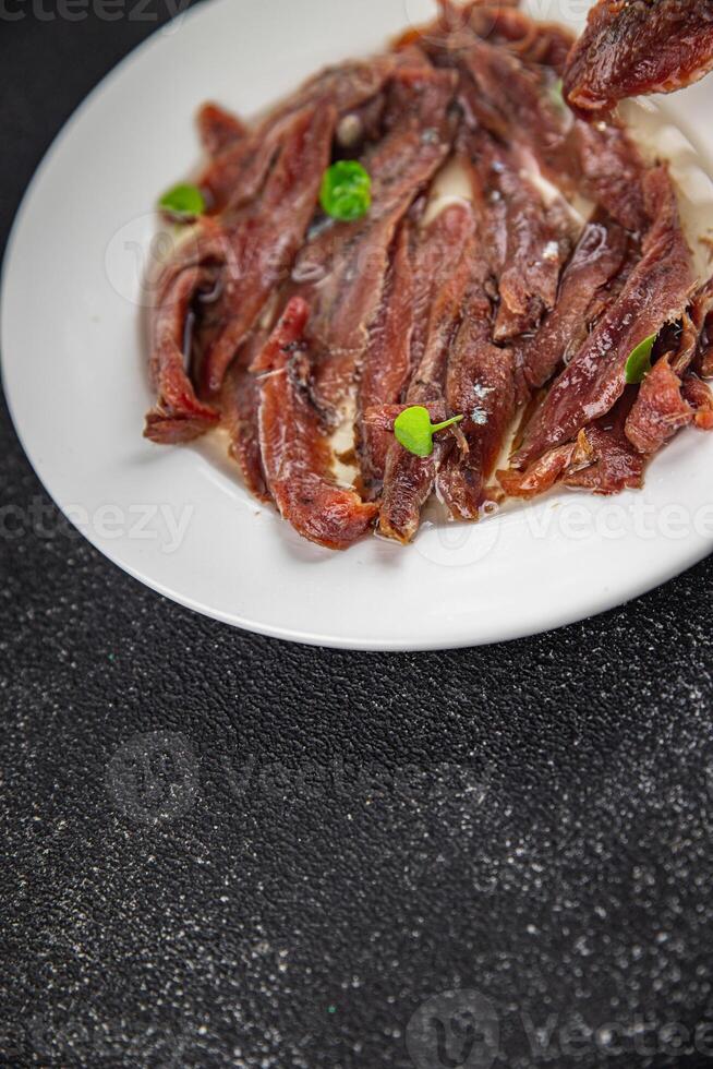 anchovies on the table canned fish in oil fresh and tasty seafood meal food snack on the table photo