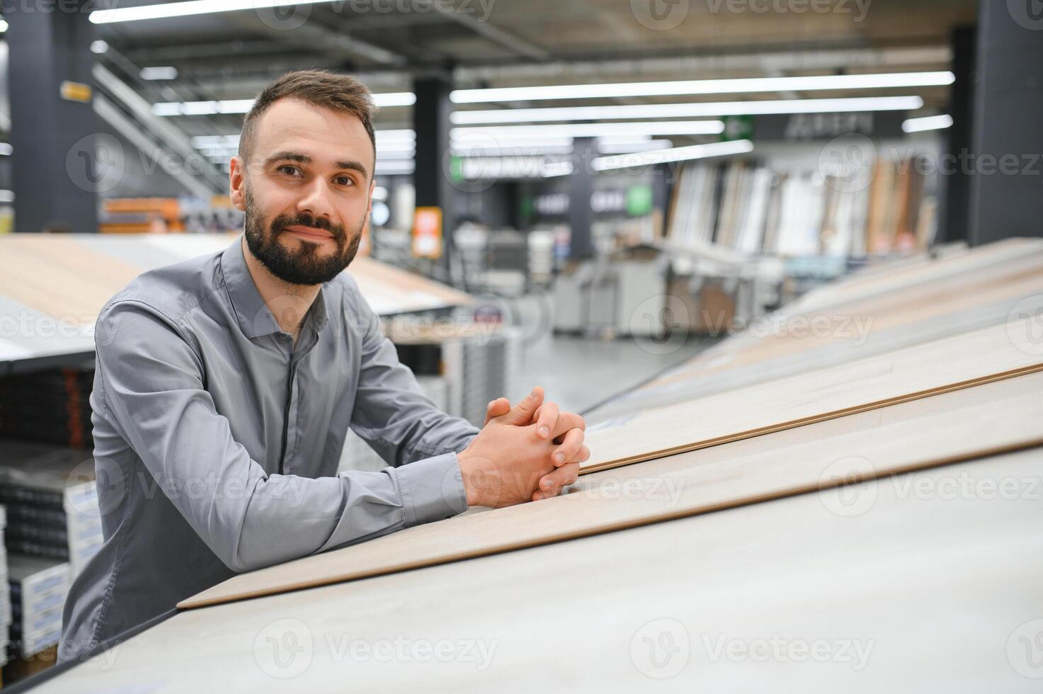 Man choosing flooring in hardware store photo