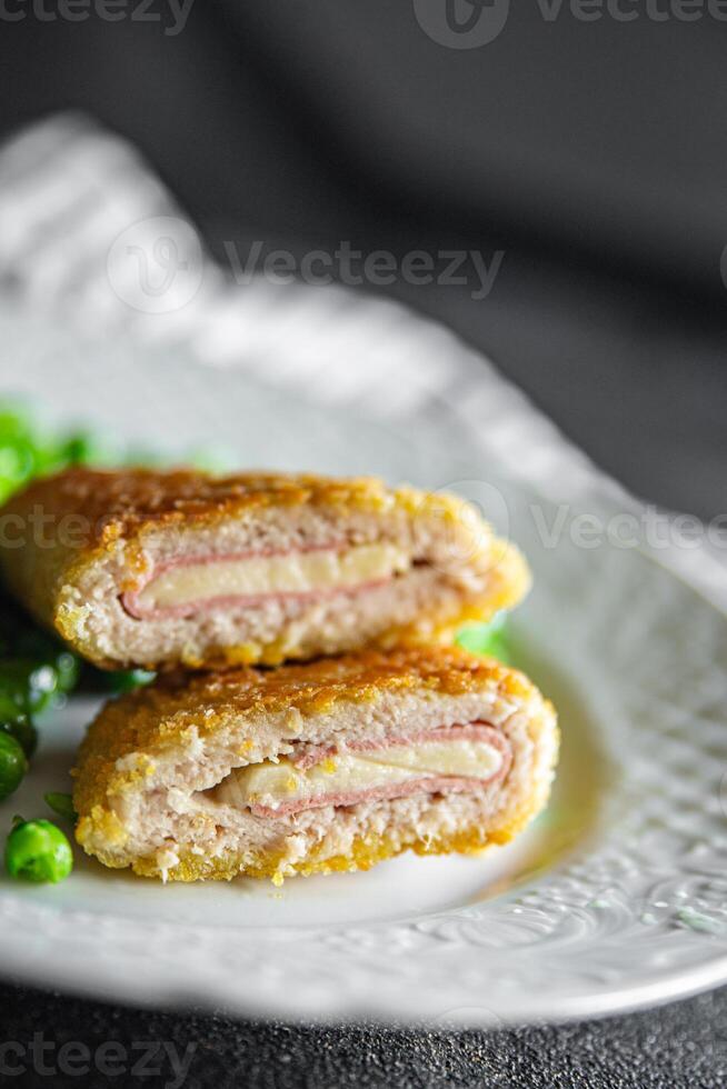meat cutlet cordon bleu chicken, cheese, bacon meal snack on the table copy space food background photo