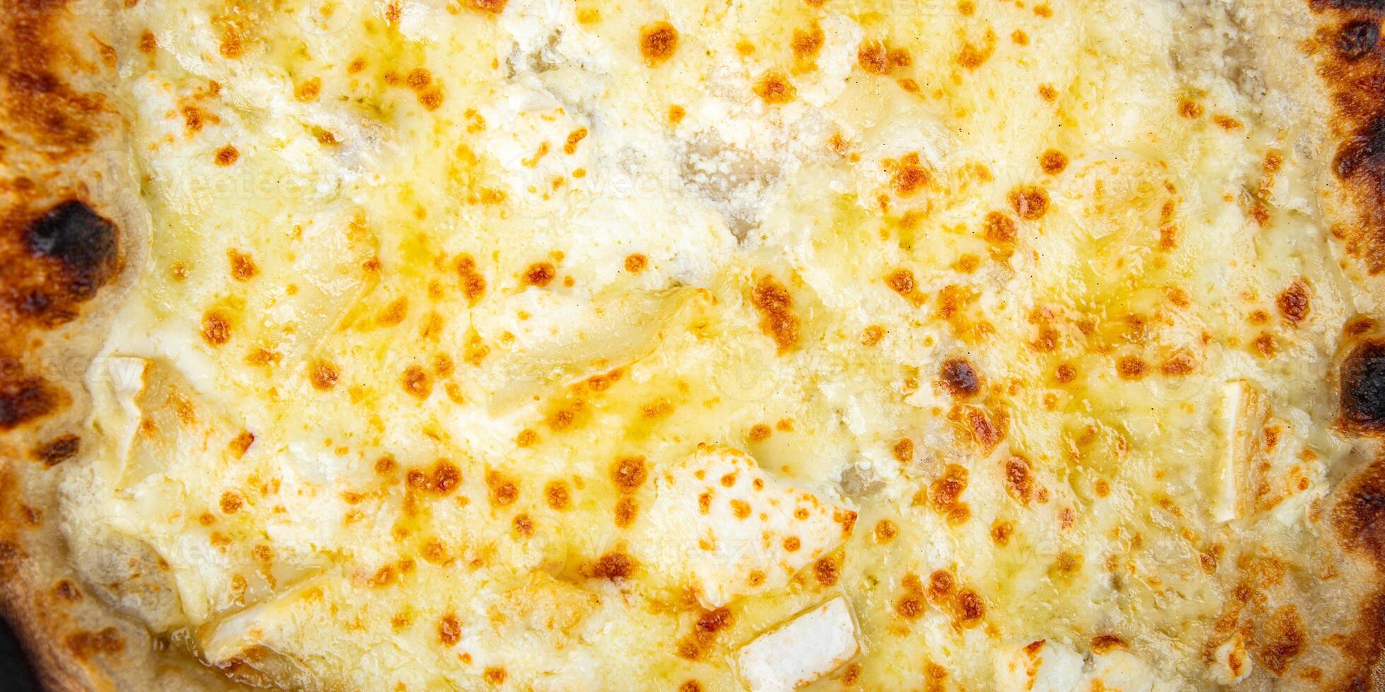 pizza four types of cheese mozzarella, blue cheese, camembert and cheddar fresh meal food snack on the table copy space food background rustic top view photo