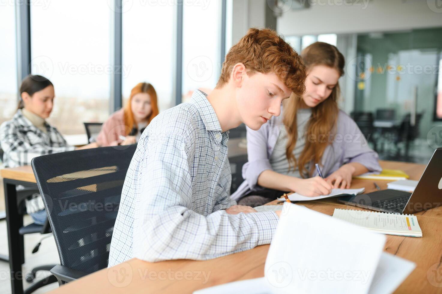 Students studying in library or classroom photo
