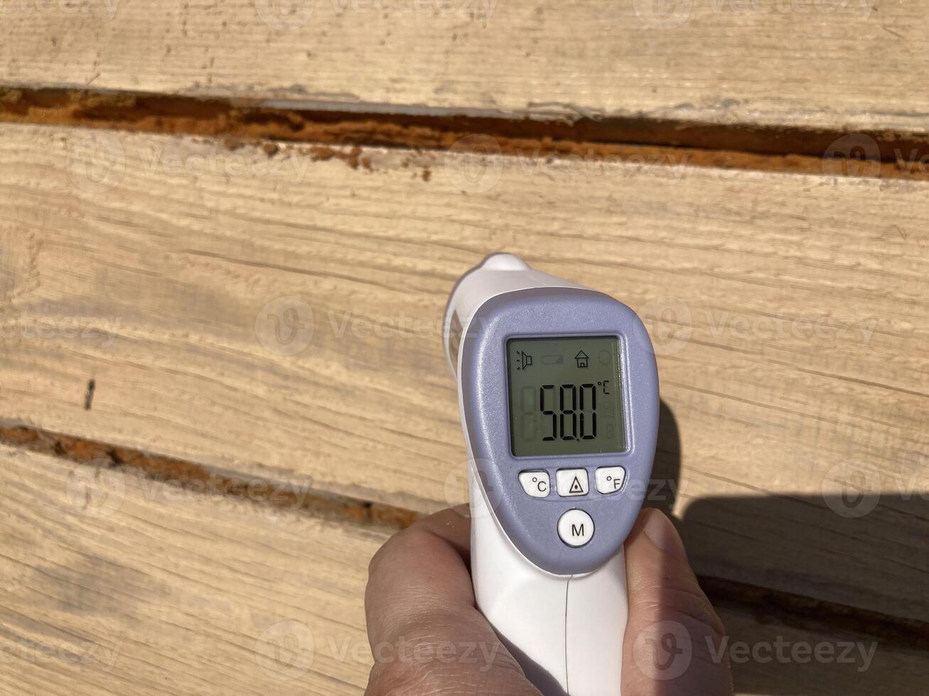 Measuring temperature with a non-contact thermometer photo