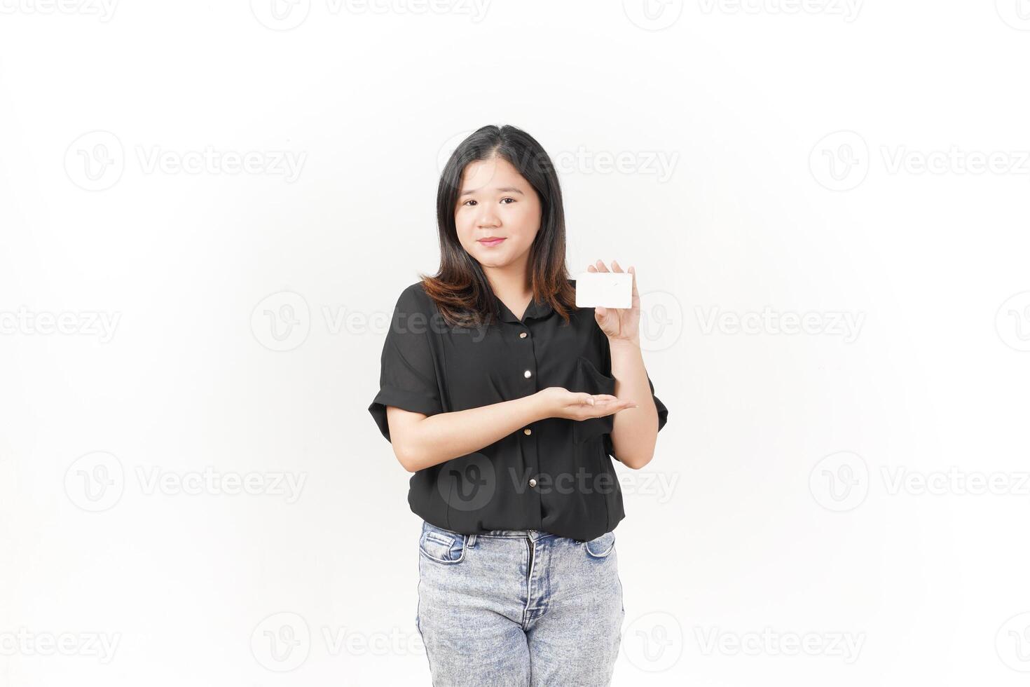 Young Asian woman presenting and showing blank card wearing Black t-shirt and jeans isolated on white background photo