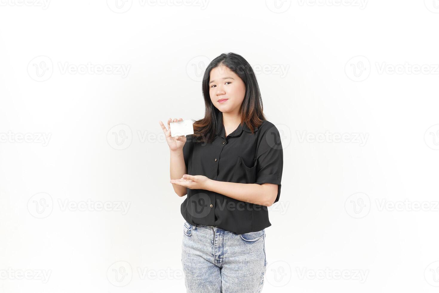 Young Asian woman presenting and showing blank card wearing Black t-shirt and jeans isolated on white background photo