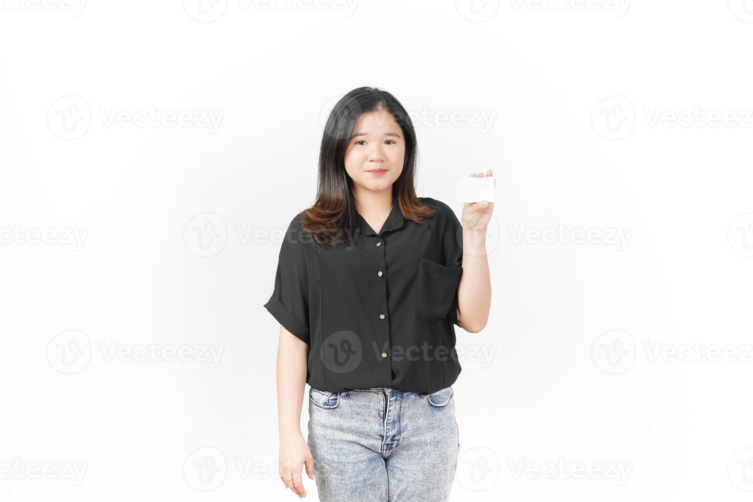 Young Asian woman presenting and showing blank card wearing Black t-shirt and jeans isolated on white background photo