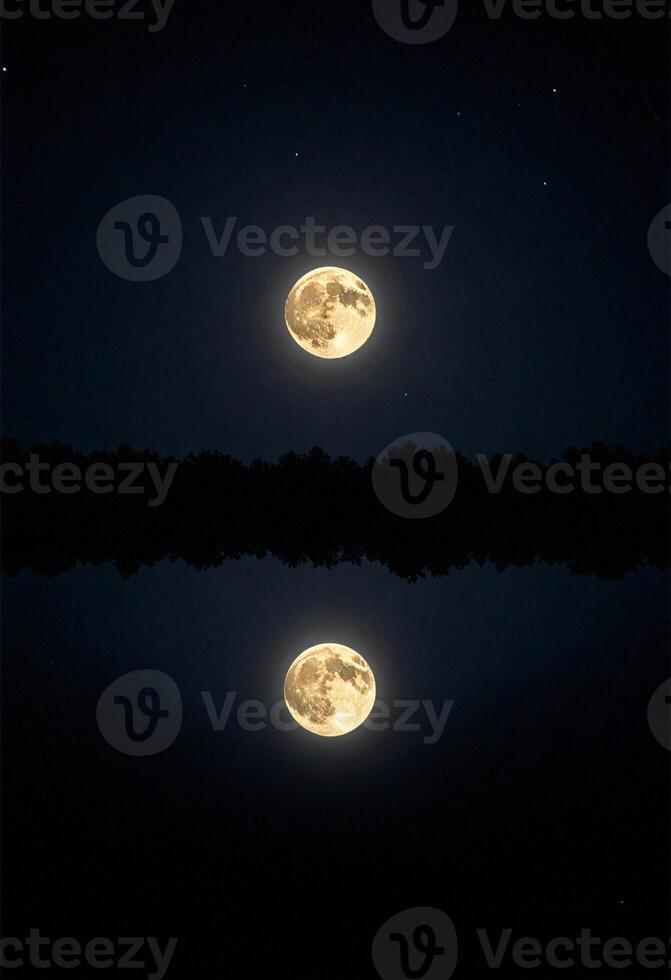 a full moon is reflected in the water and shining on the dark night sky of sharad purnima photo