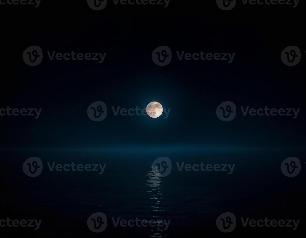 a full moon is seen over the ocean in the serene dark of the night of sharad purnima photo