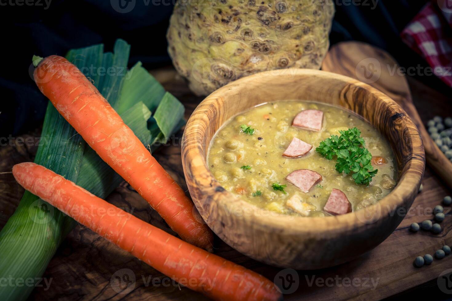 Peas Pisum sativum on olive wood for a pea soup photo