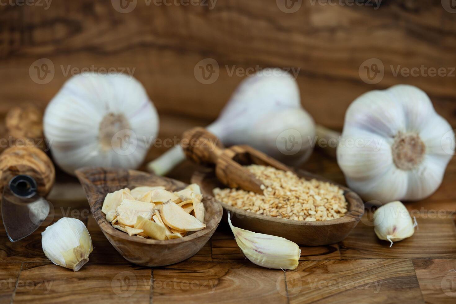 fresh and dried Garlic on olive wood photo