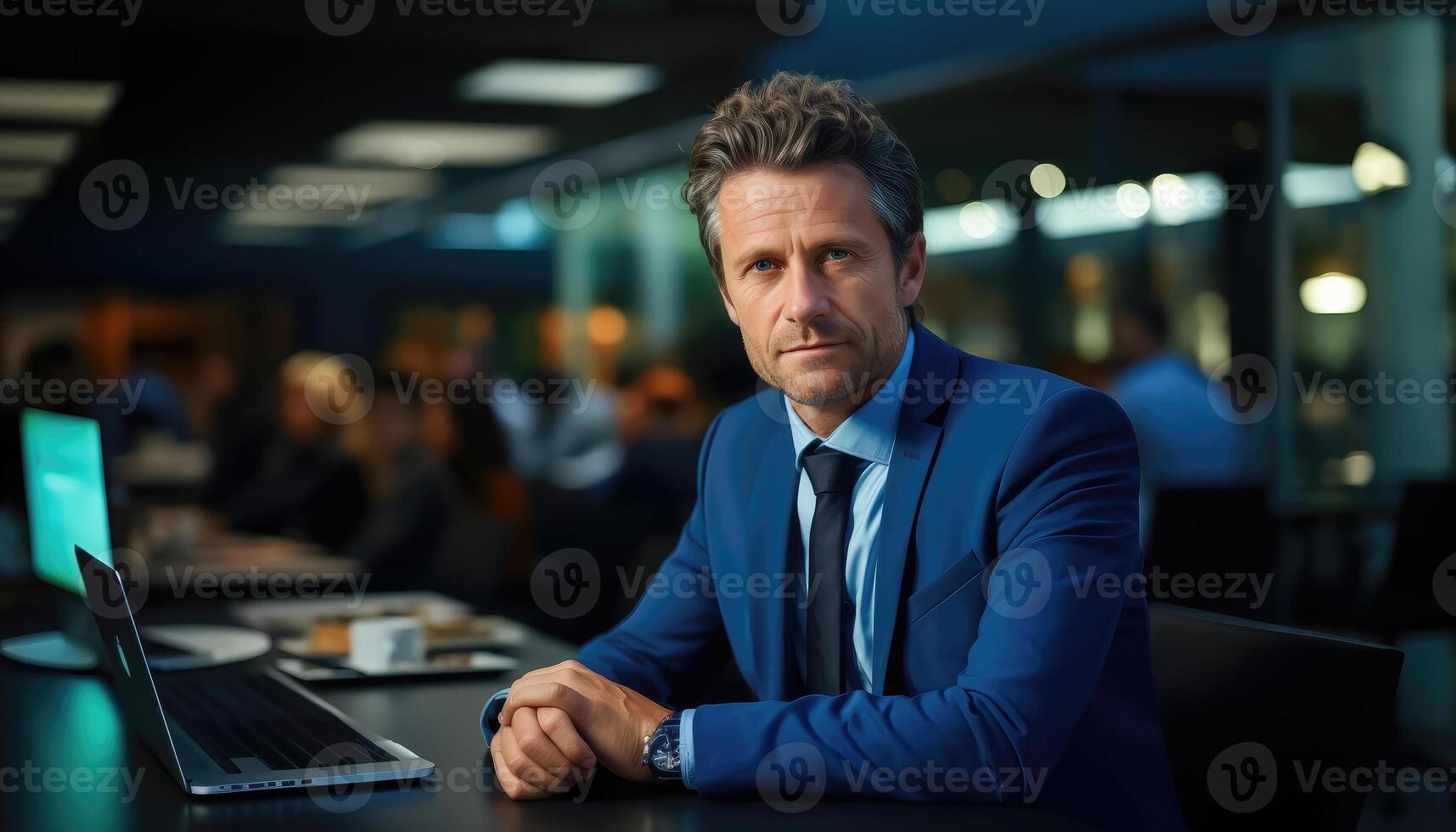Senior Executive in Formal Attire Working on a Laptop photo