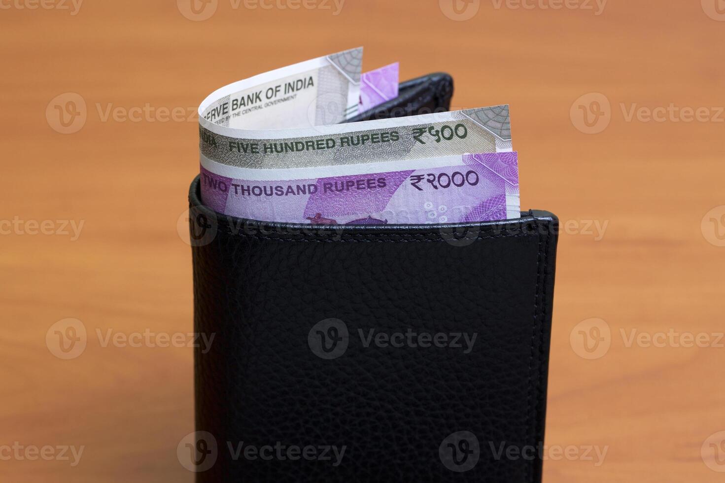 Indian rupees in the black wallet photo