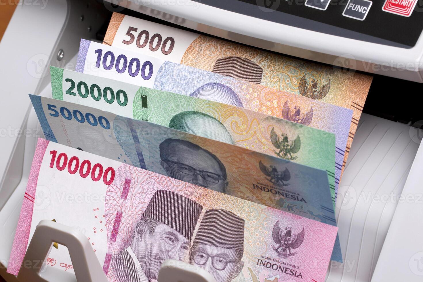Indonesian rupiah in the counting machine photo