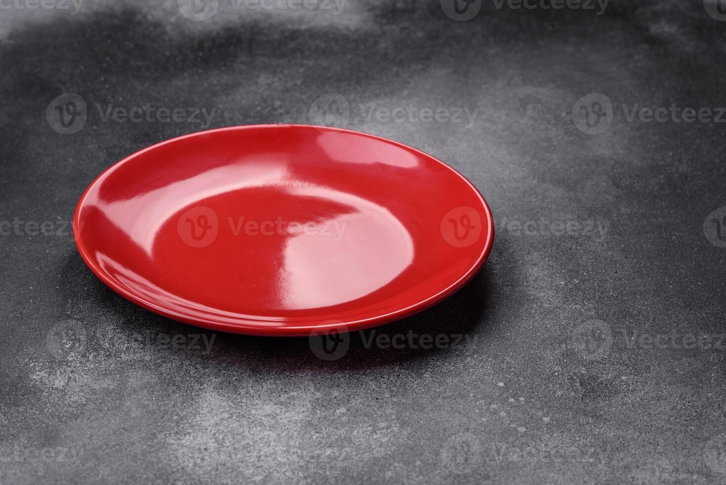 Empty ceramic plate on a dark textured background photo