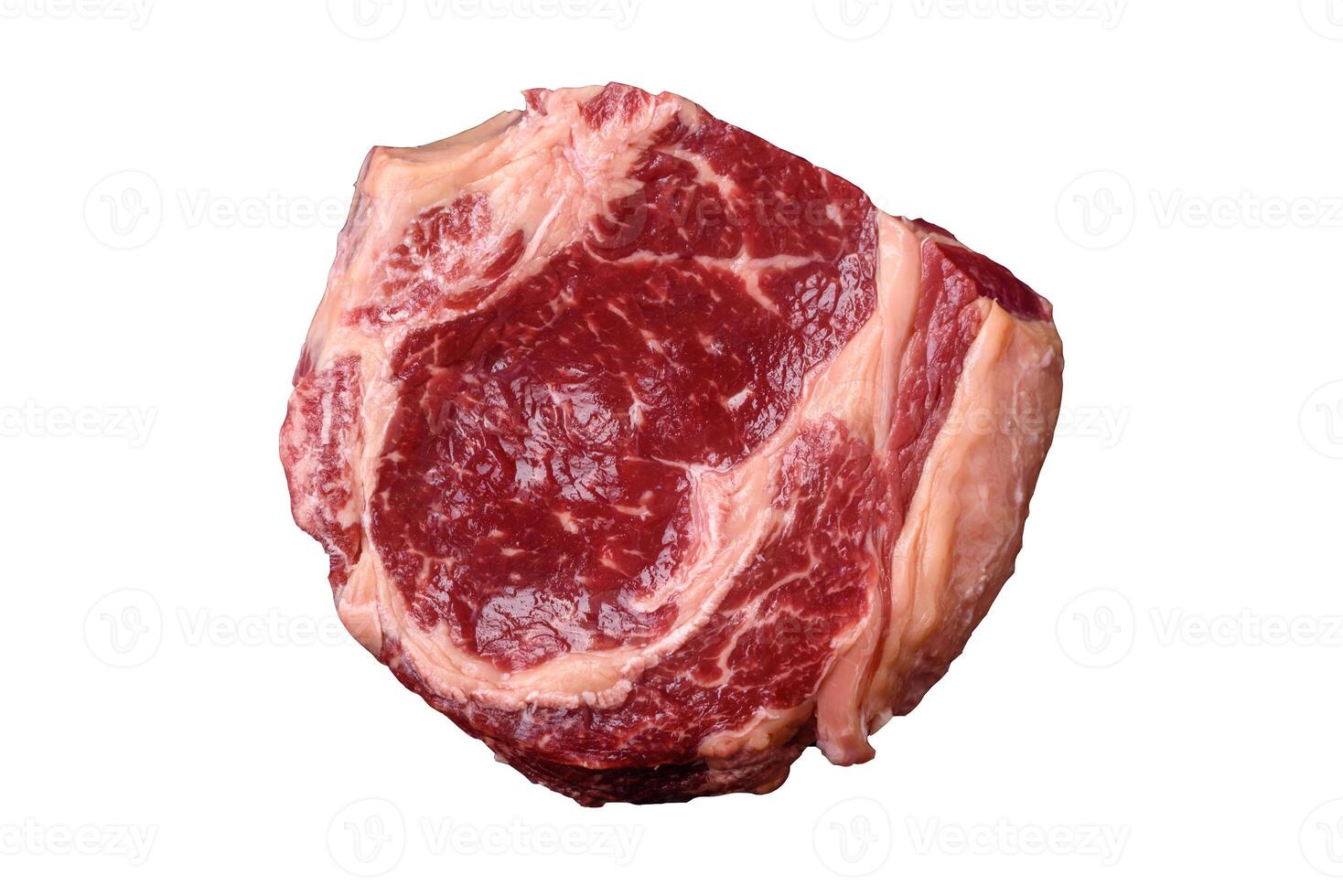 Fresh, raw beef steak with salt, spices and herbs photo
