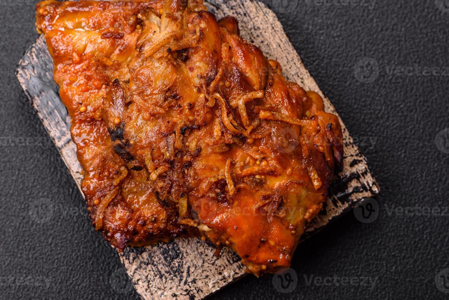 Delicious juicy grilled ribs with honey and mustard sauce with salt, spices and herbs photo