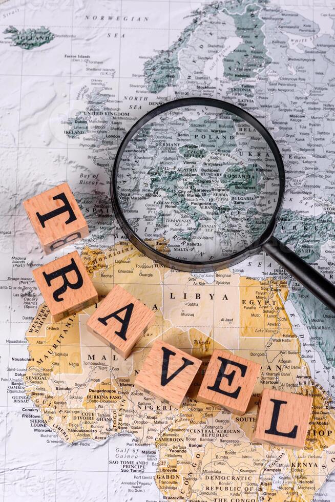 Conceptual background for travel with passport, magnifying glass, world map and money photo
